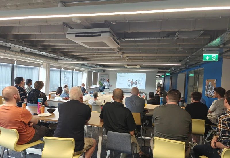 An IoT Belfast audience seated and watching a presentation at Digital Catapult in Belfast.