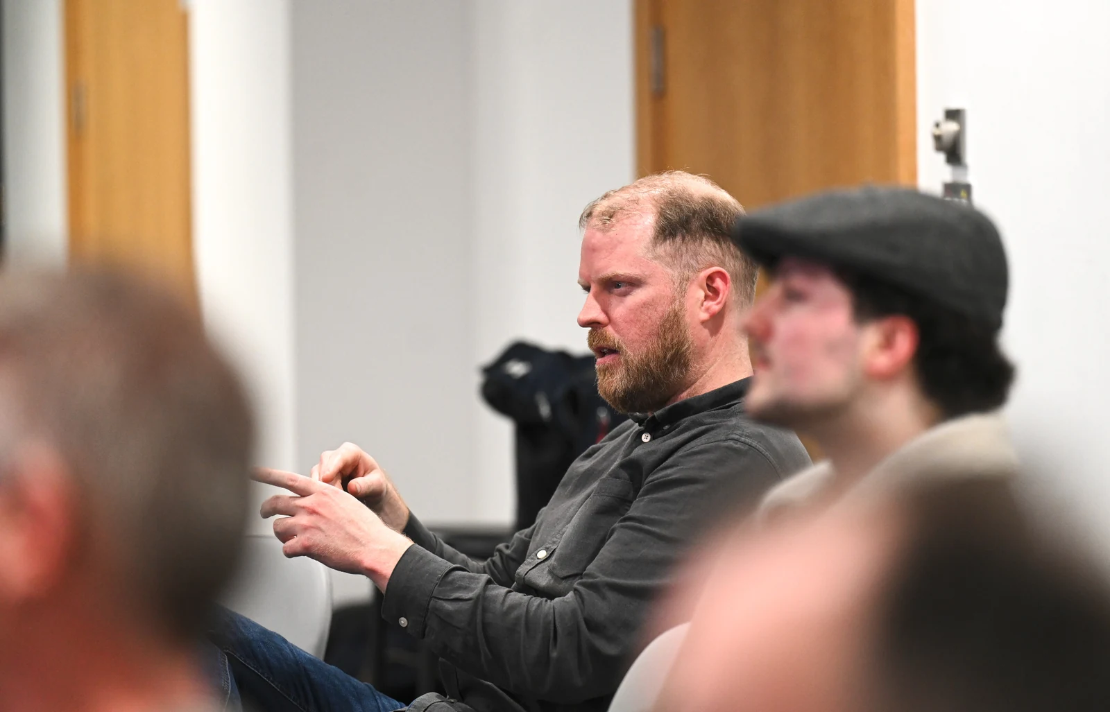 People discussing the talks during IoT Belfast 31 at Liberty IT.