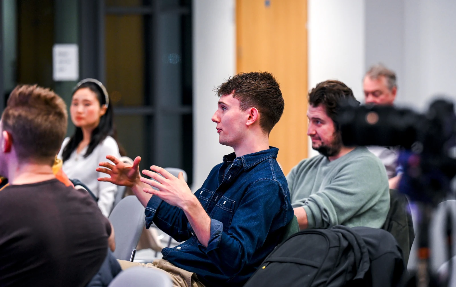 Audience member asking a question during an IoT Belfast meetup.